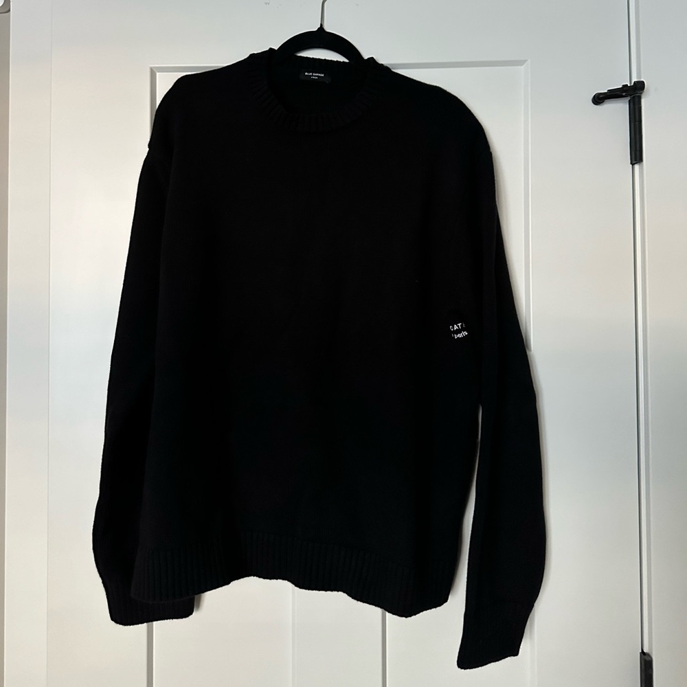 Black crewneck sweater